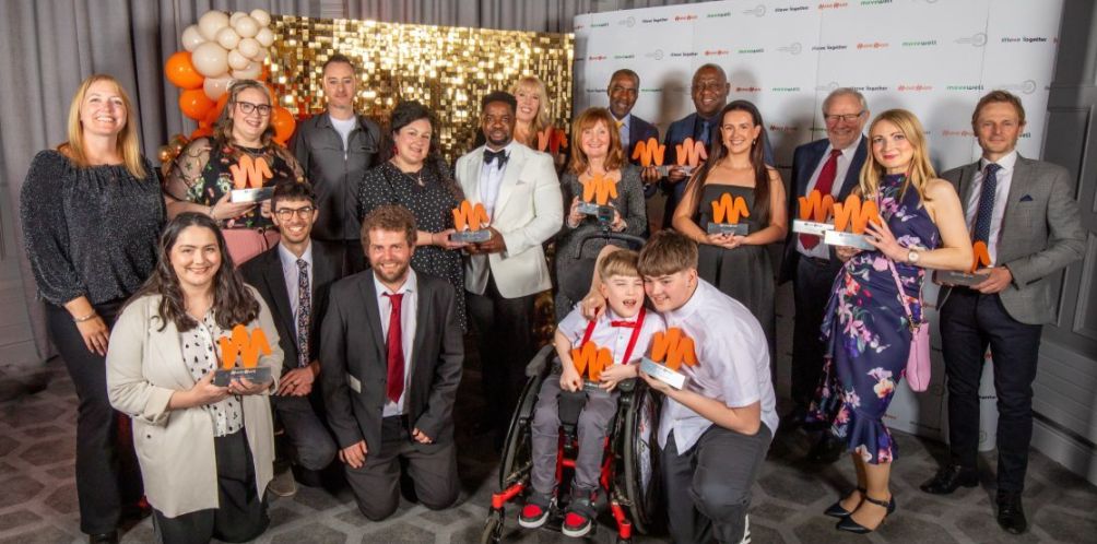 Group of people holding their Move More awards